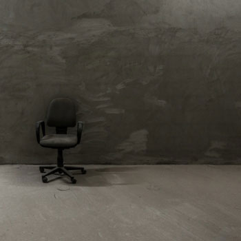 Chair in front of a grey wall
