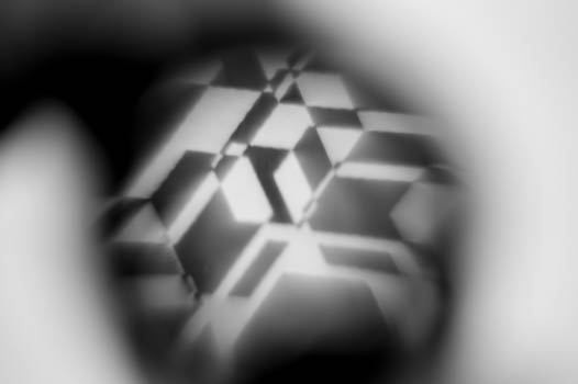 View through magnifying glass in quantum physics art installation